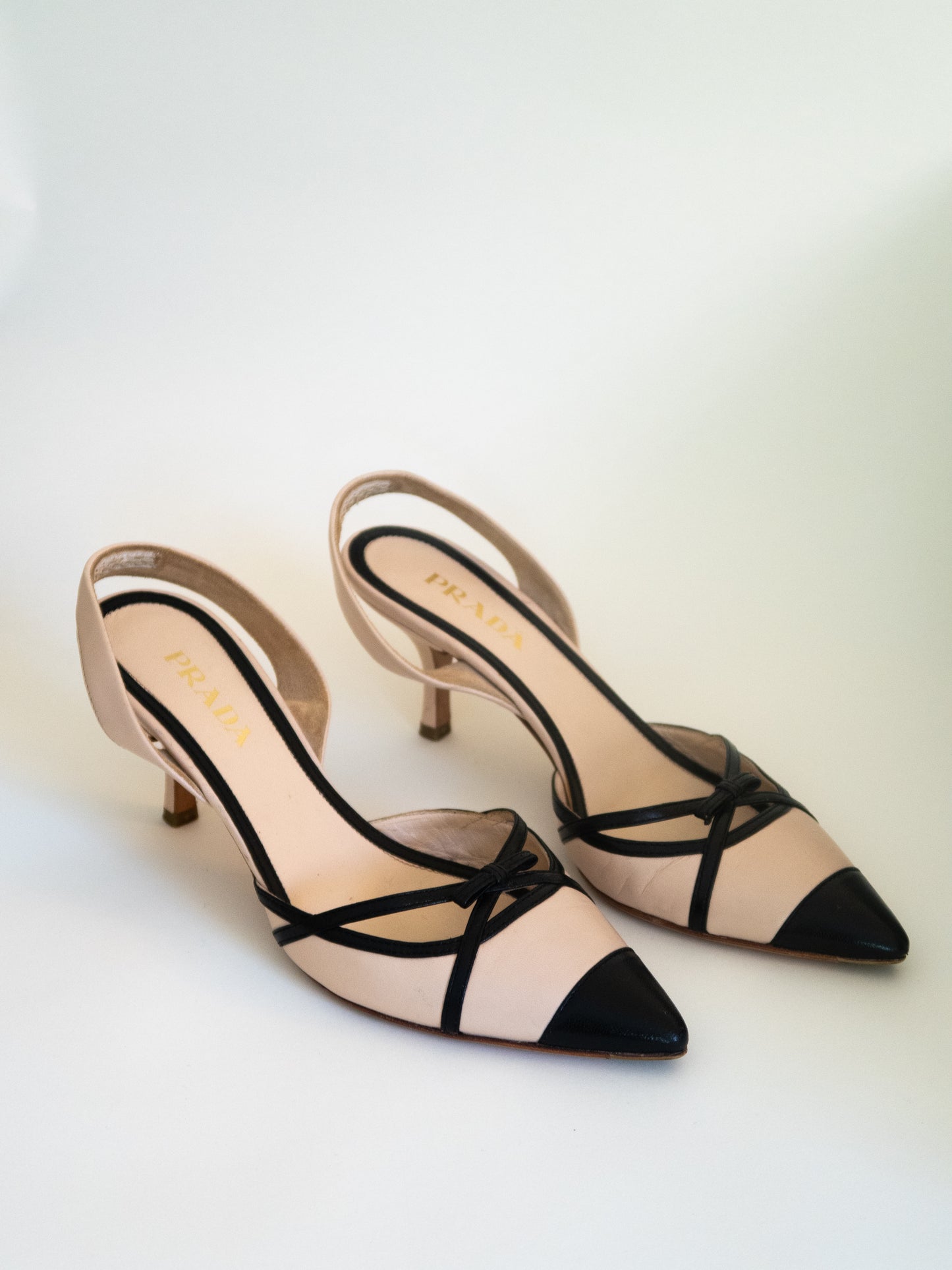 Prada Nude Leather Slingback Heels with Black Bow Detailing (EU 38)