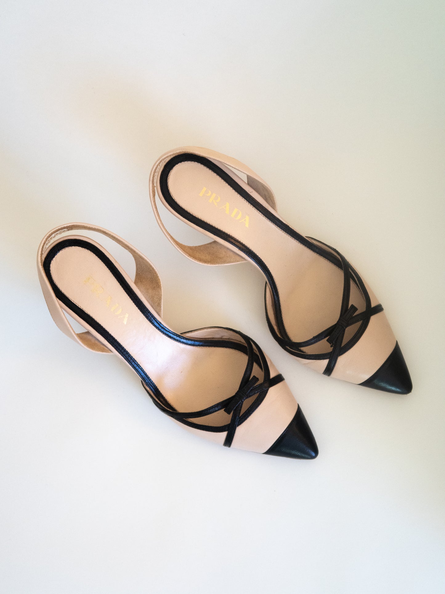 Prada Nude Leather Slingback Heels with Black Bow Detailing (EU 38)